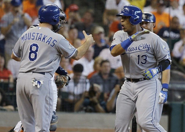 Kansas City Royals Salvador Perez celebrates with teammate Mike Moustakas right after hitting a two-run home run against the Houston Astros in the second inning during Game 4 of baseball's American League Division Series