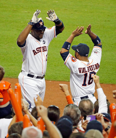 The Astros Chris Carter left celebrated with teammate Luis Valbuena after hitting a home run. Click