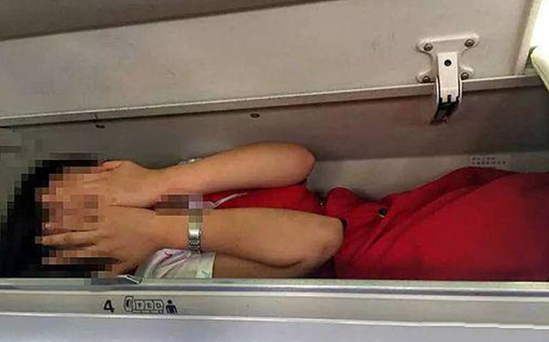 Cabin crew in China forced into overhead lockers