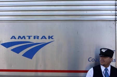 Amtrak train attendant Loxie Sanders leans against the 5 California Zephyr Amtrak train in Winnemucca Nevada