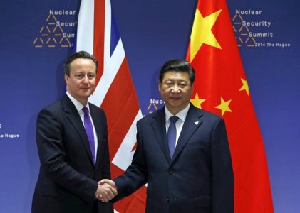 Britain's Prime Minister David Cameron meets with China's President Xi Jinping during the Nuclear Security Summit in The Hague