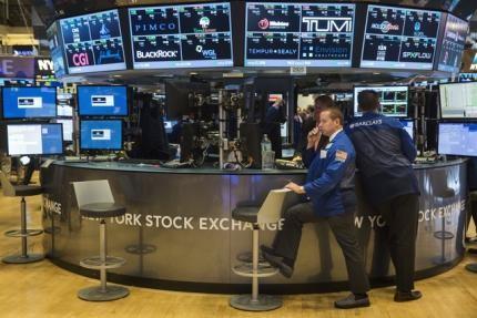 Traders work on the floor of the New York Stock Exchange