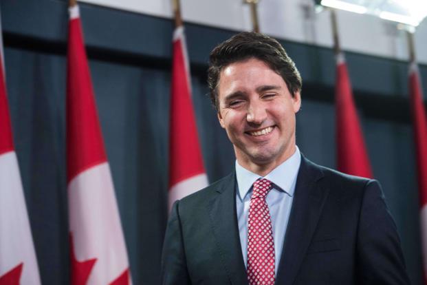 Canadian Liberal Party leader Justin Trudeau smiles at the end of a press conference in Ottawa on 20 October after winning the general elections