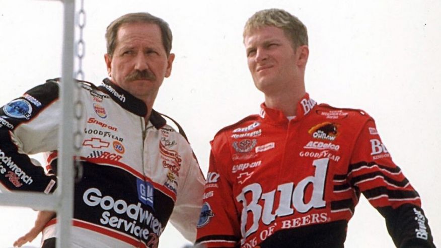 TALLADEGA AL- OCTOBER 15 Dale Earnhardt Sr. and Dale Jr. share a quiet moment while watching other cars practice at the track inTalladega Alabama