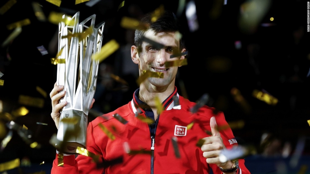 Novak Djokovic of Serbia poses with the winner's trophy after defeating Jo Wilfried Tsonga of France in the title match at the Shanghai Masters