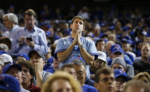 Fans wait patiently during extra innings between the Toronto Blue Jays and the Texas Rangers in game two of the American League Division Series Oct 9 2015 in Toronto