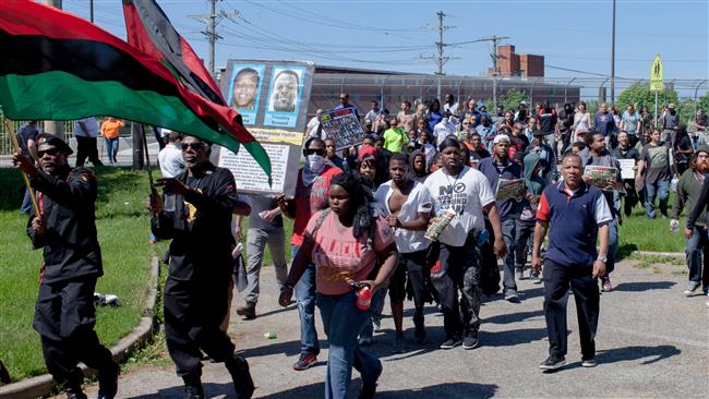 People march on May 23 to the Cuddell Recreation Center where Tamir Rice was killed in Cleveland Ohio