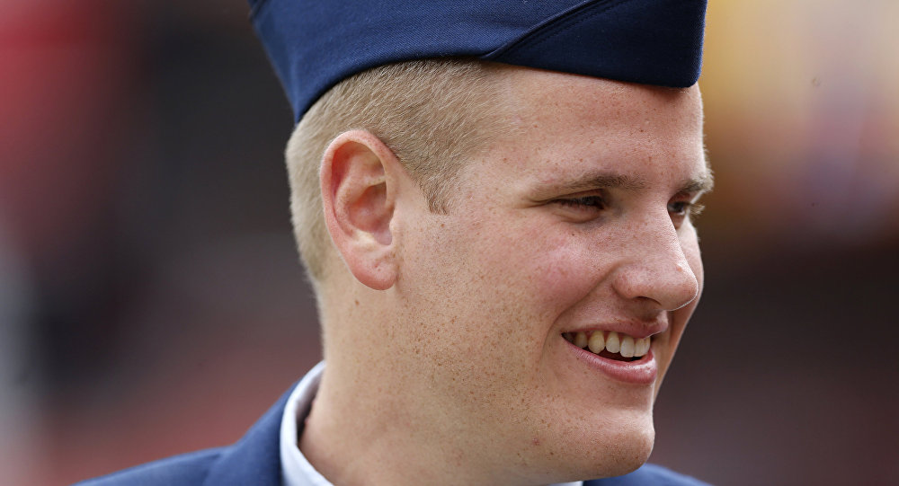 US Air Force Airman 1st Class Spencer Stone walks along the sidelines before an NFL football game in Landover Md. An Air Force spokesman said Thursday Oct. 8 2015 that Stone who helped subdue an attacker on a Paris