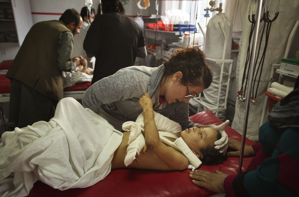 AFGHAN HOSPITAL AIRSTRIKE 7-58 Madina 8 who was at the Doctors Without Borders hospital hit by an airstrike in Kunduz is comforted Saturday by Georgia Novello a nurse at another hospital in Kabul Afghanistan. At least 22 people died and dozens more