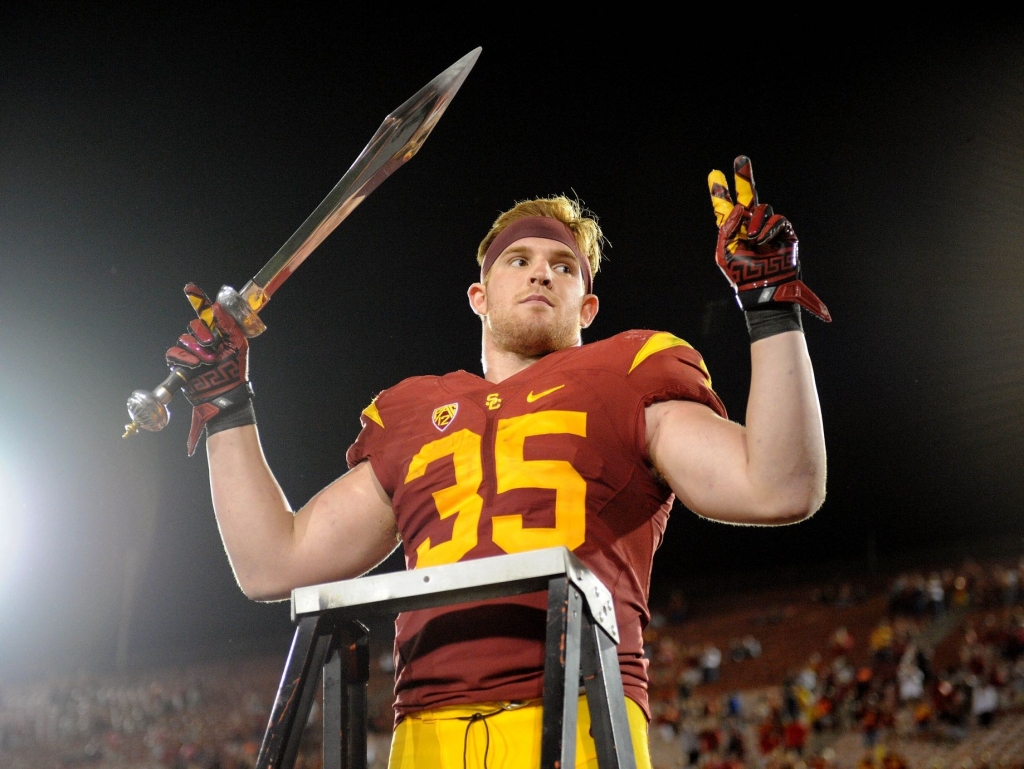 Southern California Trojans linebacker Cameron Smith celebrates the 42-24 victory against the Utah Utes at Los Angeles Memorial Coliseum. Smith recorded three interceptions and one touchdown in the game