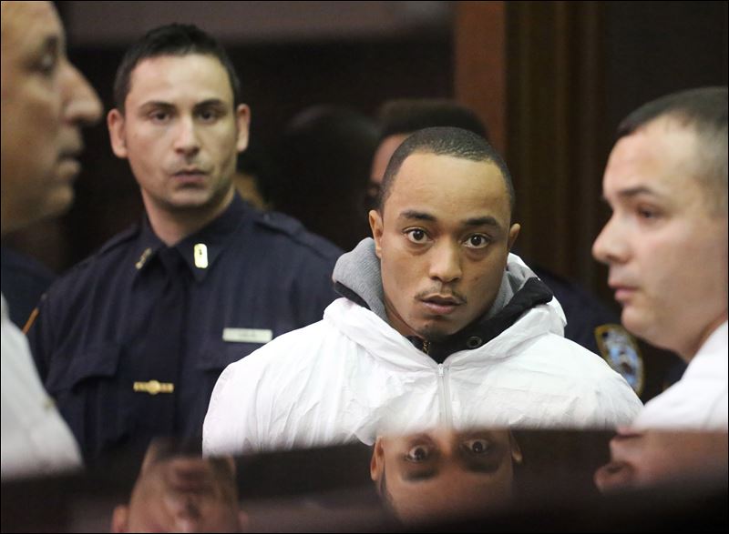 Tyrone Howard appears in Manhattan Criminal Court on Wednesday. He is accused of stealing a bike and fatally shooting Officer Randolph Holder in the head after a chase Tuesday night