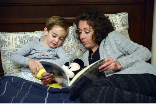 Michelle Riccio reading with her 3-year-old son Taylor had never heard of metastatic breast cancer when she was diagnosed in early 2014 at the age of 33