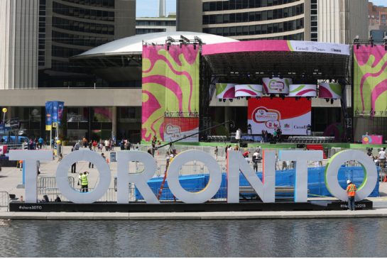 Toronto police issued arrest warrants Thursday for two Pan Am athletes