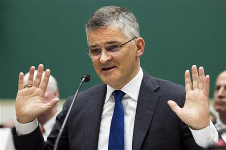 Volkswagen North America CEO Michael Horn departs after testifying before the House Energy and Commerce Committee on Capitol Hill in Washington