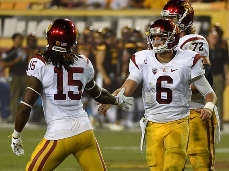 Cody Kessler #6 of the Southern California Trojans celebrates with teammate Isaac Whitney #15 after scoring a touchdown against the Arizona State University Sun Devils during the second half at Sun Devil Stadium