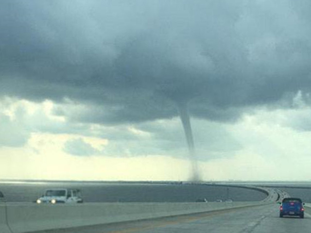 Waterspout passes over Tampa bridge mail truck                       Erin Neal