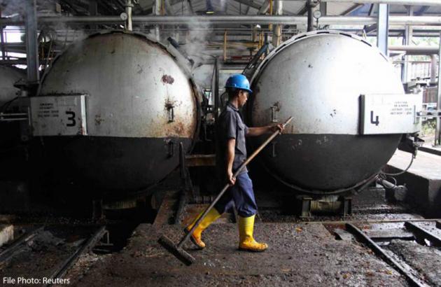 A worker at a palm oil processing plant in Indonesia