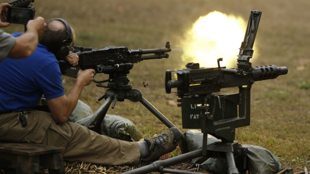 Democrats are solidifying a push for greater control in the US. Here a shooter files a a belt-fed machine gun earlier this month at the Knob Creek Machine Gun Shoot in Kentucky considered one of the largest gun shows in the world dealing specifically