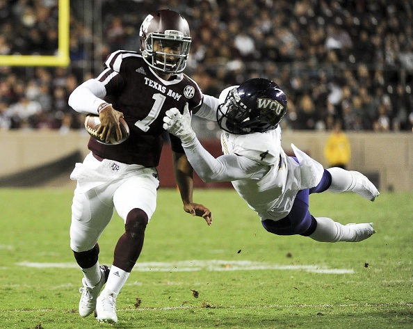 COLLEGE STATION TX- NOVEMBER 14 Kyler Murray #1 of the Texas A&M Aggies is tackled by Sertonuse Harris #4 of the Western Carolina Catamounts in the second quarter of a NCAA football game at Kyle Field