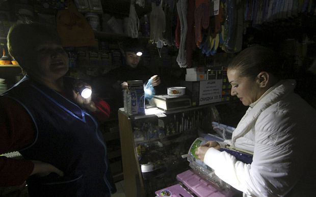 A customer visits an appliance shop with power turned off inside in Simferopol Crimea