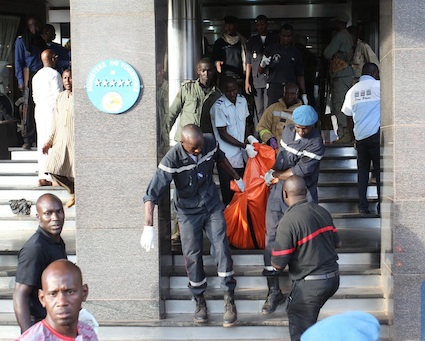 A dead victim being taken out of the Radisson Blu hotel in Bamako