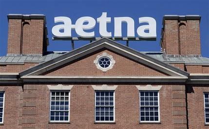 A sign for Aetna Inc. sits atop a building at the company headquarters in in Hartford Conn