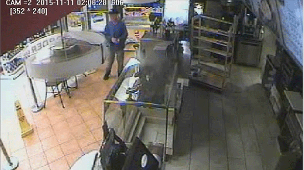 A suspect in a Remembrance Day poppy box theft at a Etobicoke gas station is shown in this surveillance camera image