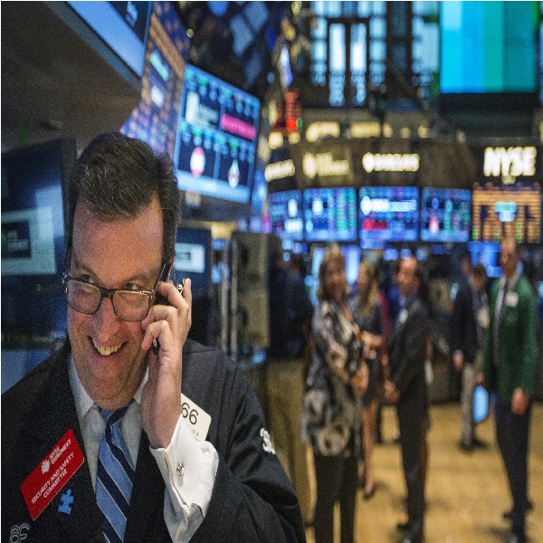 A trader works on the floor of the New York Stock Exchange shortly before the end of the day's trading