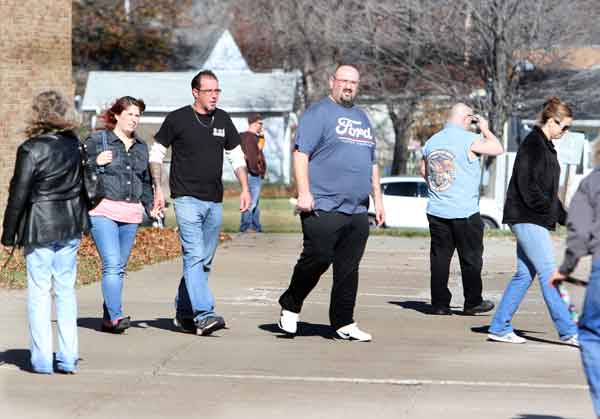 ANNA NORRIS  CHRONICLE Members of UAW Local 2000 leave Lorain High School Sunday morning after voting on a new three-year Ford Motor Company contract