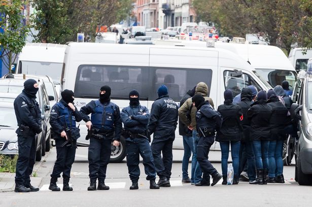 Armed police guard a street in Brussels earlier this week