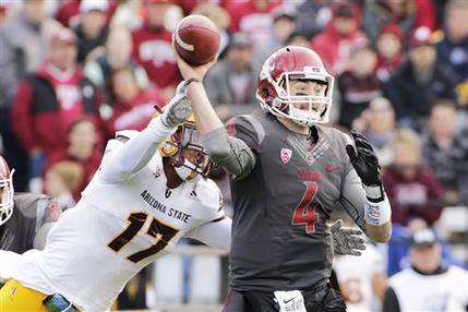 Washington State quarterback Luke Falk passes as he is hit by Arizona State linebacker Ismael Murphy Richardson Nov. 7 2015 in Pullman Wash