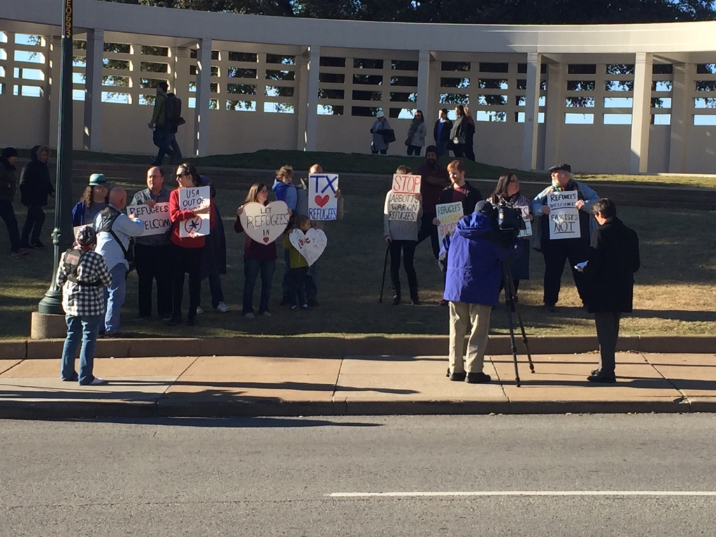 Protesters stand outside Dealey Plaza to blast anti Syrian-refugee sentiment