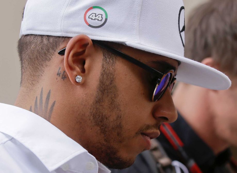 Mercedes driver Lewis Hamilton of Britain walks at the paddock prior to the start of the third free practice at the Yas Marina racetrack in Abu Dhabi United Arab Emirates Saturday Nov. 28 2015. The Emirates Formula One Grand Prix will take place on Su