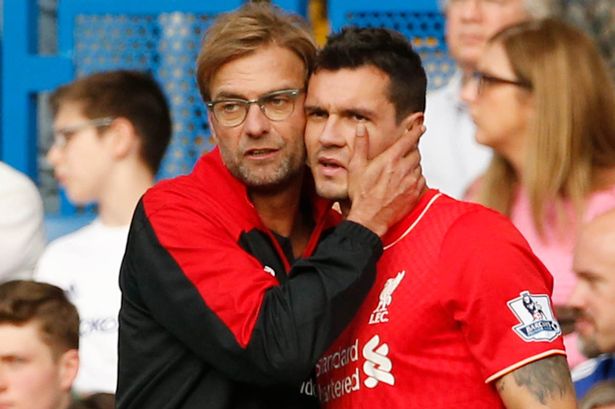 Jurgen Klopp talks to Dejan Lovren before bringing him