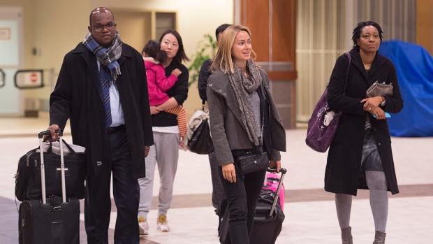 Passengers from Air France Flight 55 head through the terminal at Halifax Stanfield International Airport on Nov. 18 2015