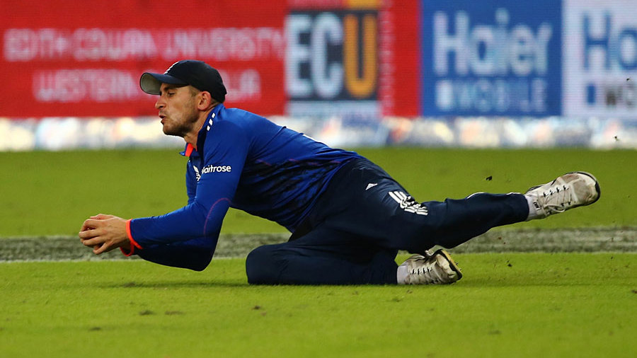 Alex Hales took a stunning catch diving forward after running in from the deep to remove Shoaib Malik