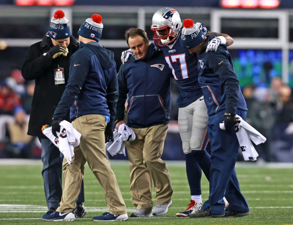 WELCOME BACK Receiver Aaron Dobson is helped off the field after being injured during the Pats’ 20-13 win against the Bills last night in Foxboro