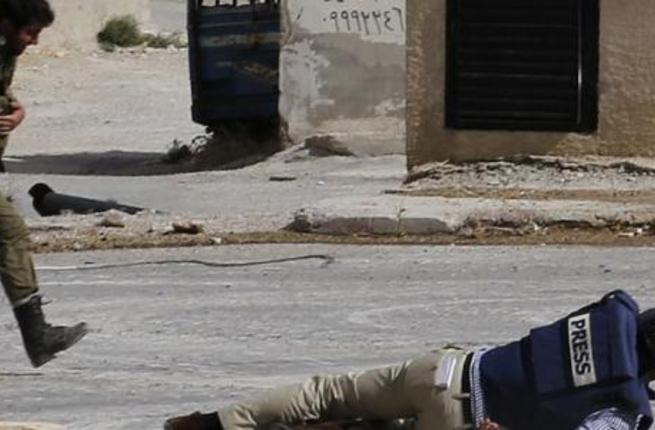 An AFP journalist takes cover during an attack in Syria