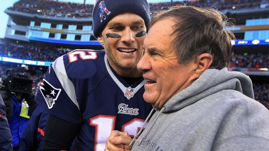 FOXBOROUGH MA DECEMBER 14 Patriots quarterback Tom Brady and head coach Bill Belichick share a moment as the final seconds tick off the clock in their victory which gave them their 6th straight AFC East title. The New England Patriots hosted the Miam