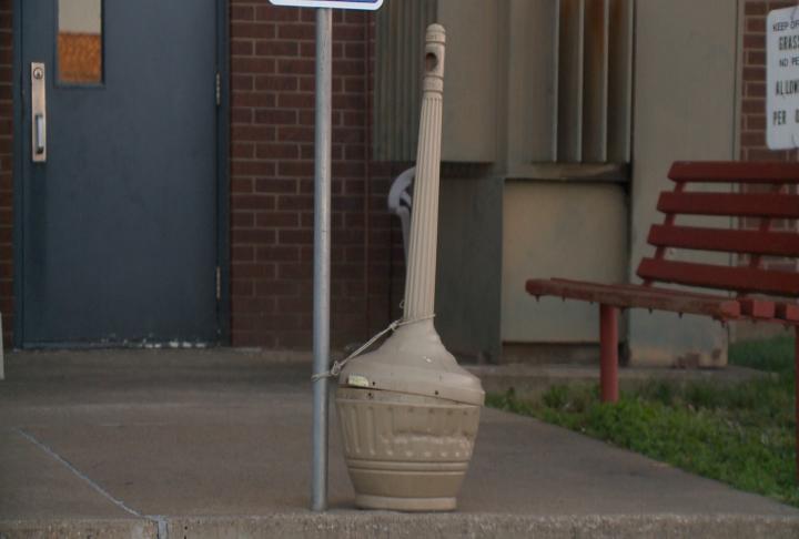 An ash urn stands outside Lampe High-Rise