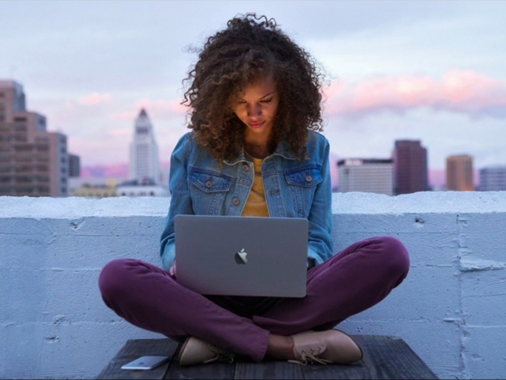 AppleA woman uses Apple's MacBook a 12-inch laptop designed for casual use