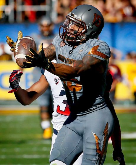 Arizona State wide receiver Devin Lucien pulls in a catch as Arizona cornerback Cam Denson defends during the first half of an NCAA college football game Saturday Nov. 21 2015 in Tempe Ariz