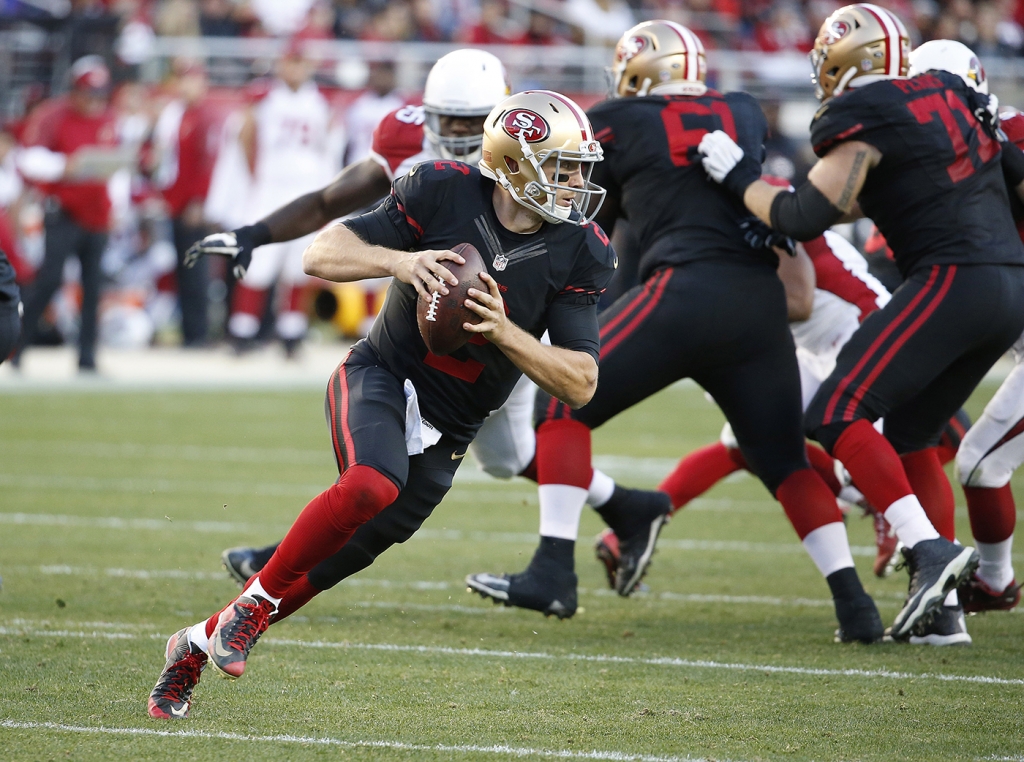 49ers quarterback Blaine Gabbert rolls out against the Arizona Cardinals during the game on Sunday