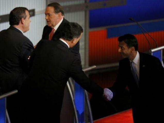 Republican U.S. presidential candidate and former U.S. Senator Rick Santorum shakes hands with Louisiana Governor Bobby Jindal as New Jersey Governor Chris Christie shakes hands with former Arkansas Governor Mike Huckabee at the con