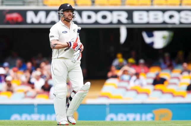 New Zealand captain Brendon Mc Cullum walks from the Gabba after Australian bowler Mitchell Marsh claimed the wicket during the first cricket test match between Australia and New Zealand in Brisbane