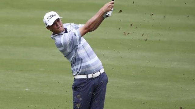 Golf-Scrambling Spieth struggles in Sydney cross-winds