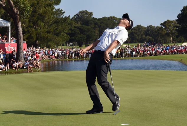 Australia's Matt Jones celebrates after sinking his final putt to win the Australian Open golf tournament in Sydney