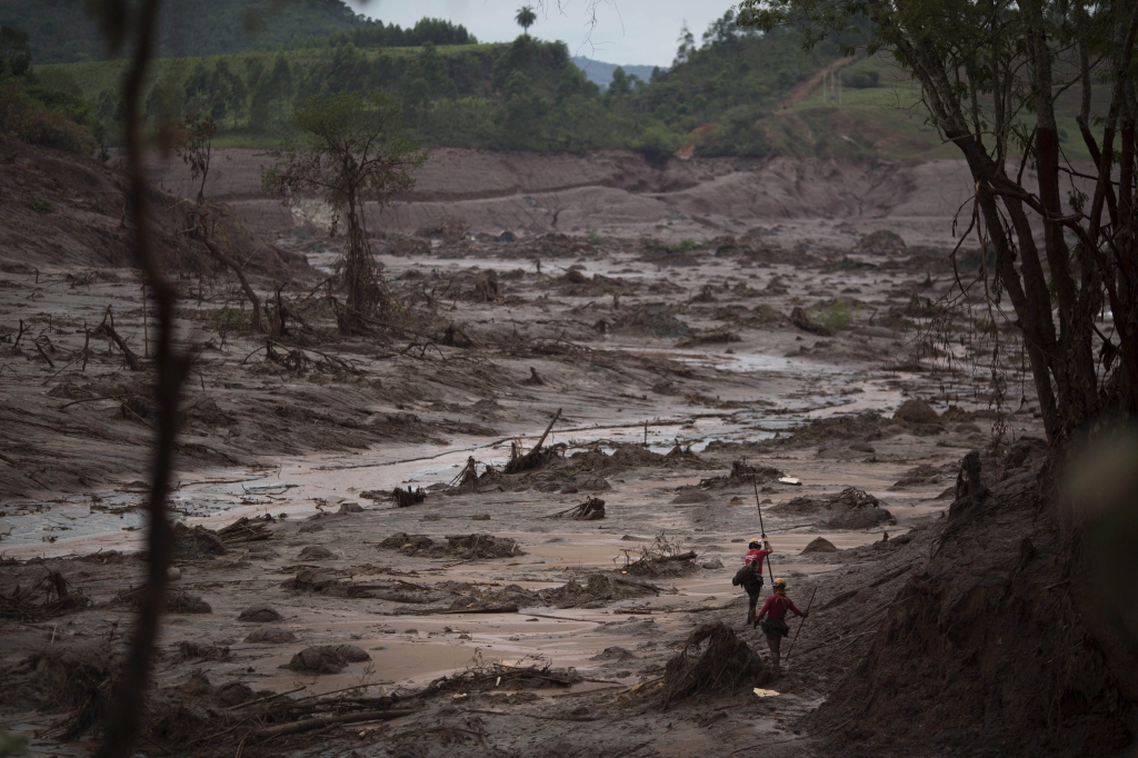 Rescue workers search for victims at the site where the town of Bento Rodrigues stood after two dams burst on Thursday in Minas Gerais state Brazil Sunday Nov. 8 2015