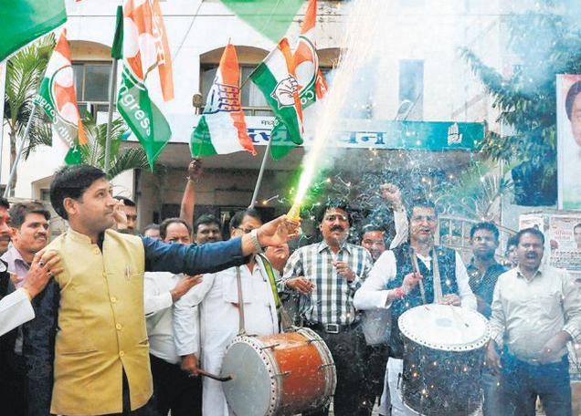 Congress workers celebrating the victory from Ratlam seat
outside the PCC office in Bhopal on Tuesday