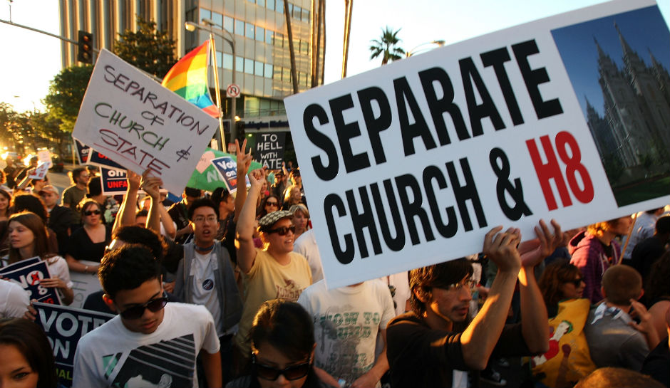 Protesters gather to denounce the Mormon church's anti-gay stance